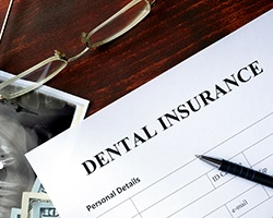 Insurance paperwork for the cost of dental implants in Dallas, GA