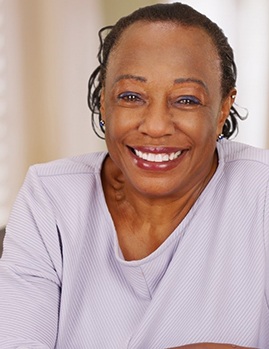 Smiling woman with dentures in Dallas, GA