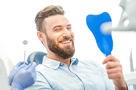 Man smiling in the dental chair