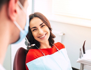 Woman using dental insurance in Dallas