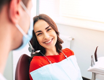 Woman using dental insurance in Dallas