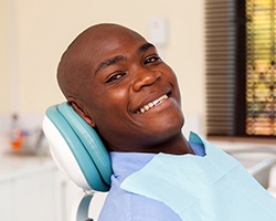 man smiles after getting dental implants in Dallas, GA