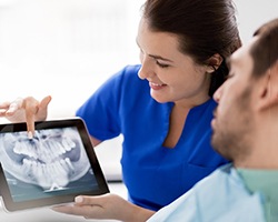 Patient listening to dentist in Dallas