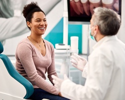 Candidate for oral conscious sedation in Dallas speaking with dentist