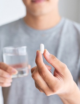 man holding out oral conscious sedation in Dallas, GA