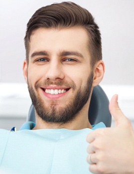 Candidate for oral conscious sedation giving thumbs up