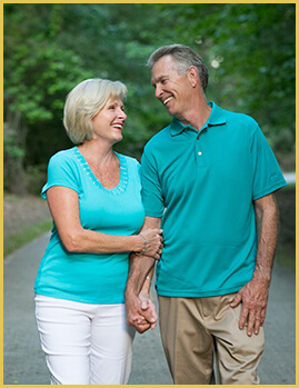 smiling couple with dental implants in Dallas, GA