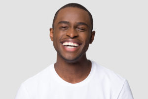 Laughing man enjoying the benefits of smiling