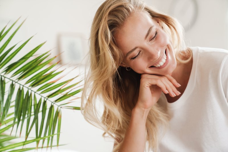 Young woman smiling in her apartment