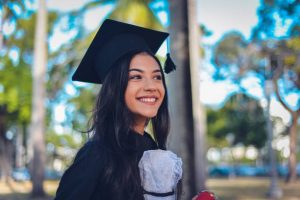 Young woman in cap and gown