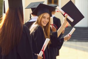 Happy graduate holding her diploma
