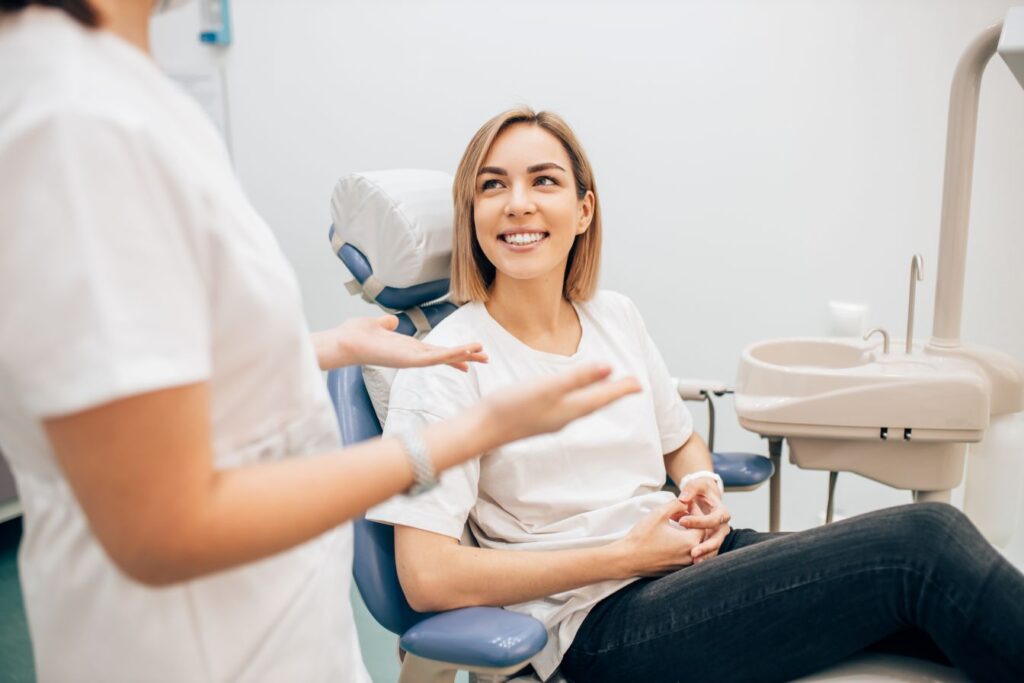 A woman sitting in a dental chair