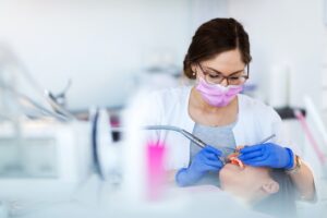 Dentist working on patient.